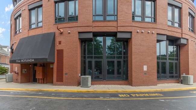 Building Photo - Industrial-Themed Mid-Rise, One-Level Cond...