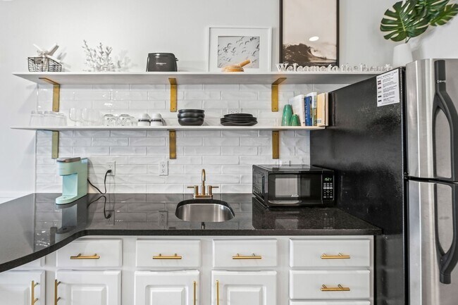 Building Photo - Available now.  Cute Furnished Studio Cond...