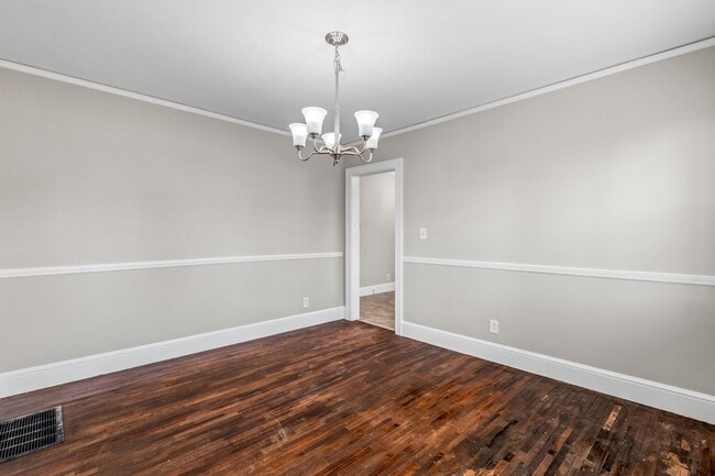 Building Photo - SW, Large Brick Two Bedroom PLUS Two Sun-Rooms, Hardwoods, LR & Separate DR, Fire Place!