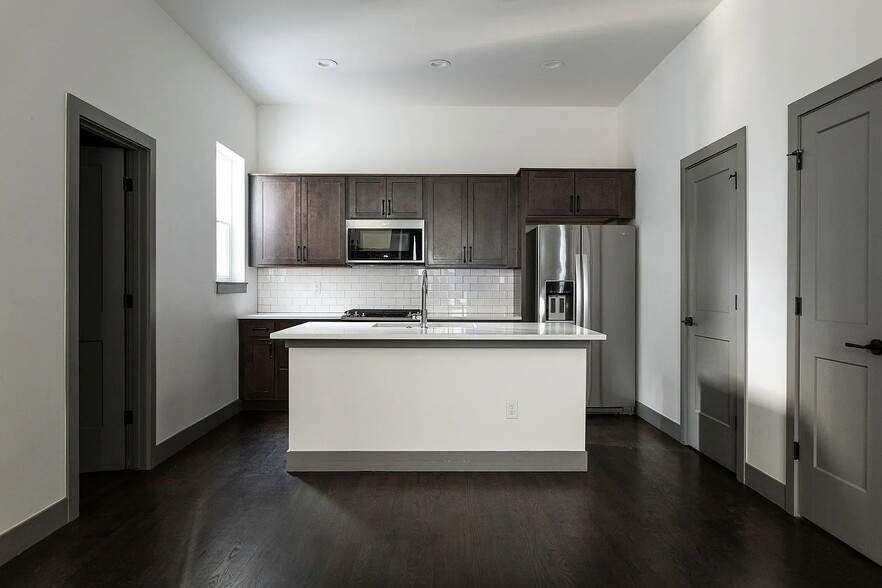 Living Room to Kitchen View. Main Floor Half Bath on left - 3505 S Marion St