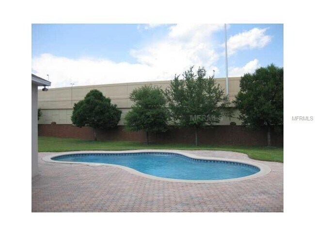 Building Photo - Spacious 4-Bedroom Pool Home with 3-Car Ga...