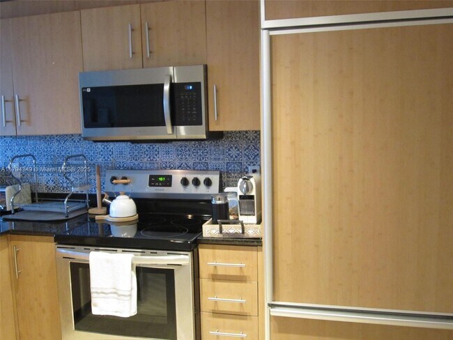 Building Photo - 10275 Collins Ave