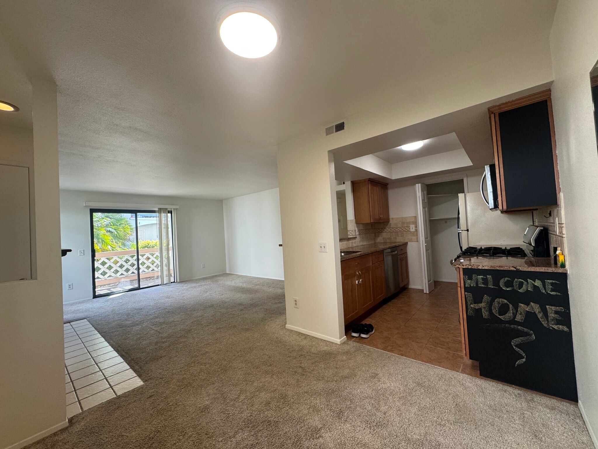 Kitching, living room, and balcony/patio - 9408 Twin Trails Dr