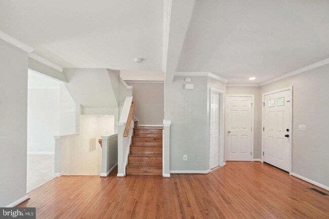 Building Photo - Amazing, updated end unit townhome backing to trees and open common area in Centre Ridge neighbor...