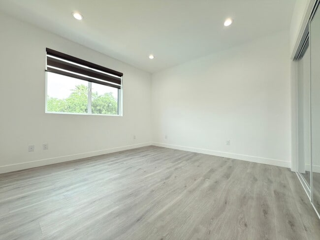 Building Photo - Chic Modern Living in Panorama City – 4 Be...