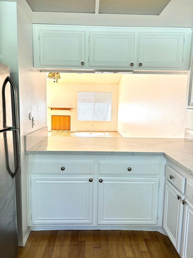 Building Photo - Available Now is a Condo style Townhouse i...