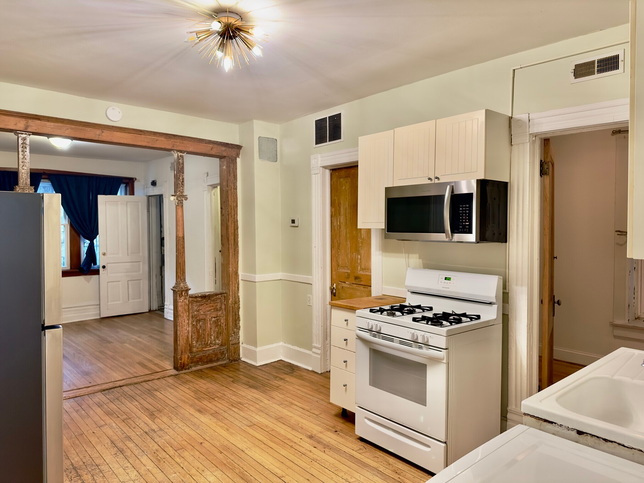 kitchen, living room beyond - 2640 West Thomas Street