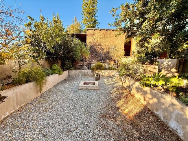 Building Photo - Hilltop Highland Park Sanctuary with Views, Private Gated Yard, In Unit Laundry, Parking & Abunda...