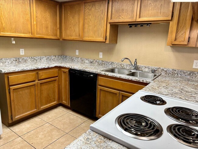 Building Photo - Downstairs Corner 2-Bedroom Condo in Centr...