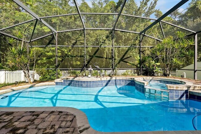 Building Photo - "Stunning 3BR Orlando Home with Private Screened Pool, Spa & Spacious Living Areas"