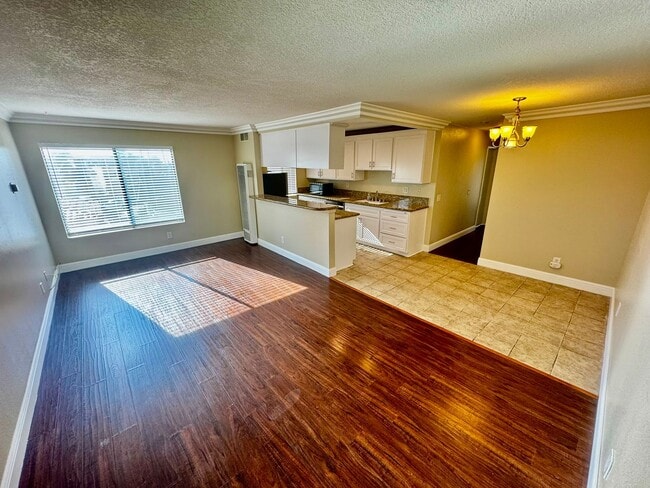 Building Photo - Updated 2nd Floor Corner Unit -3425 E. 15t...