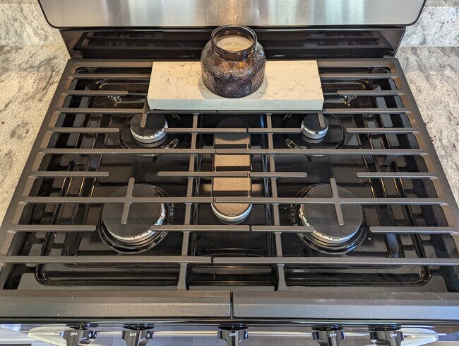 5-burner gas stove is perfect for the home chef, including a griddle burner. - 2008 E Huntsville Rd