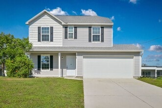 Building Photo - 3BR/2.5BA Cape Coral Home w/ 2-Car Garage & Spacious Yard – Available Now!