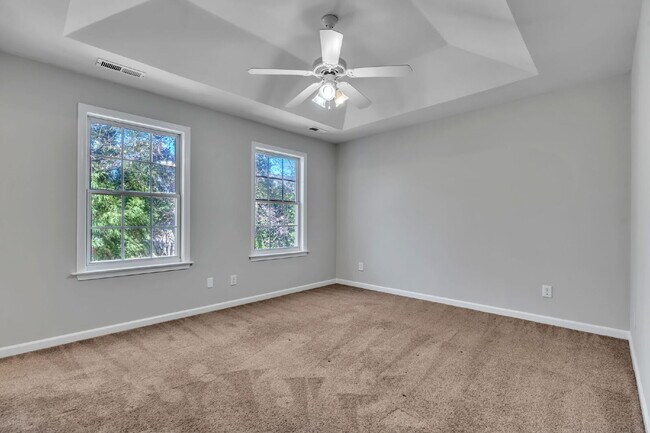 Building Photo - Beautifully Appointed 4BR Home Featuring a Screened Porch, Spacious Living Areas & Community Pool...