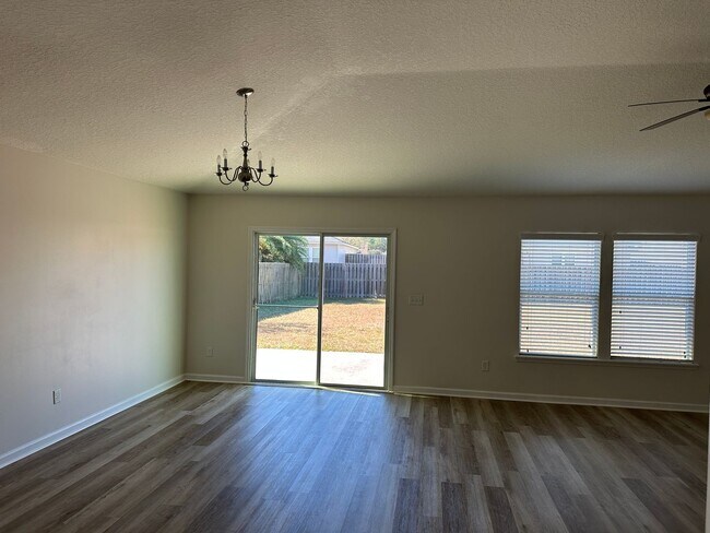 Building Photo - Spacious 4-Bedroom Home with Fantastic Ame...
