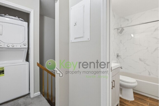 Building Photo - Spacious 2BR/2BA Duplex in Gated Community with Parking, Washer/Dryer & NYC Skyline Views