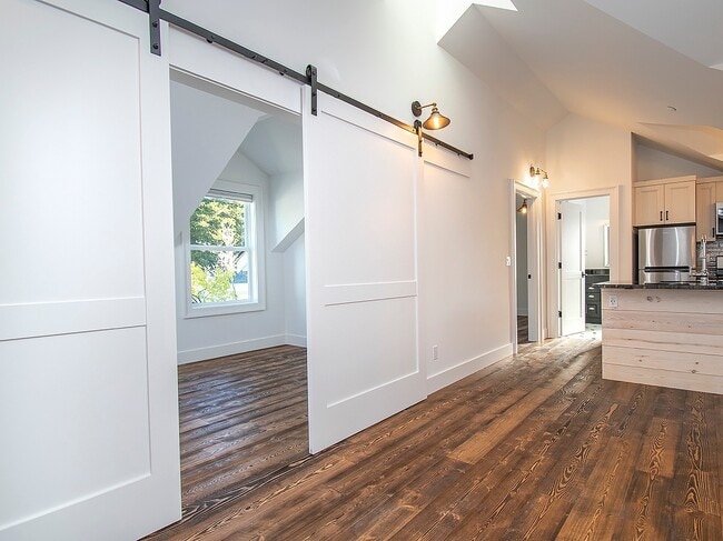 Building Photo - Expansive Loft-Style Carriage House in Private Haller Lake Estate