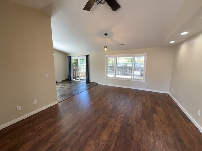 Building Photo - Newley updated 3-bedroom home features fenced yard, garage, and covered patios!