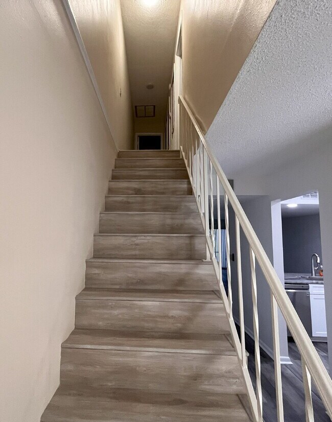 Building Photo - Two-story condominium, featuring 2 bedrooms and 2 1/2 bathrooms