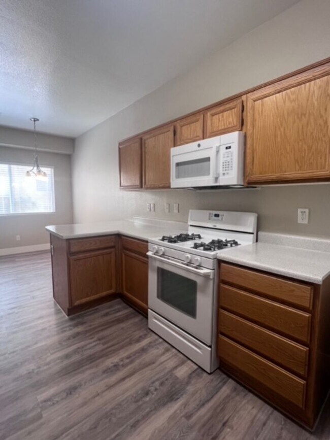 Building Photo - Three bedroom townhouse with 2 car garage