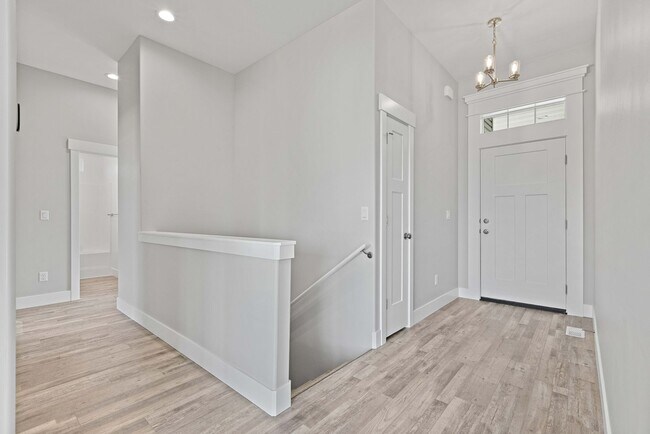 Building Photo - NEW HOME with large garage stalls and unfinished basement for additional storage