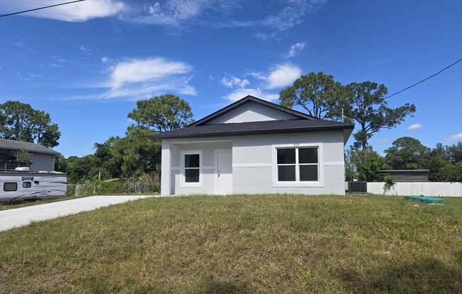 Building Photo - BRAND NEW-- TWO BEDROOM + TWO BATHROOMS- SOUTH LEHIGH ACRES