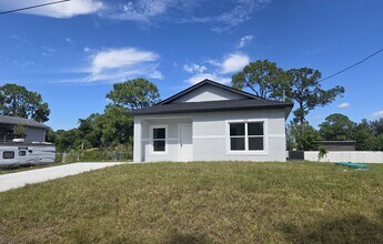 Building Photo - BRAND NEW-- TWO BEDROOM + TWO BATHROOMS- SOUTH LEHIGH ACRES