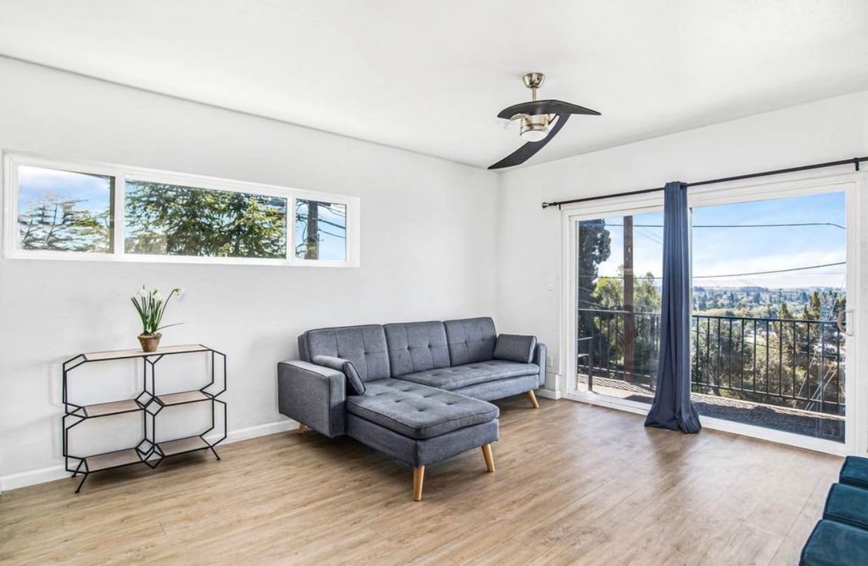 Staged living room and view before renovations - 3051 Malcolm Ave