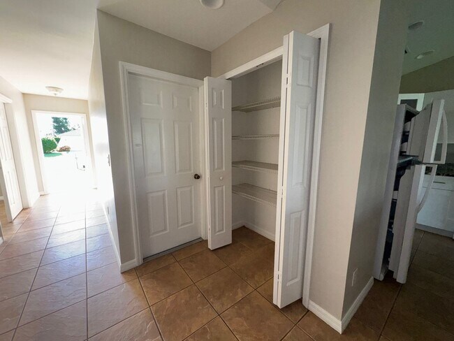 Building Photo - Experience this Cape Coral 3 bedroom 2 bath corner duplex with 1 car garage and screened in lanai.