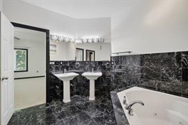 Building Photo - Spacious 5-Bed Walkout Home with Over 3,50...