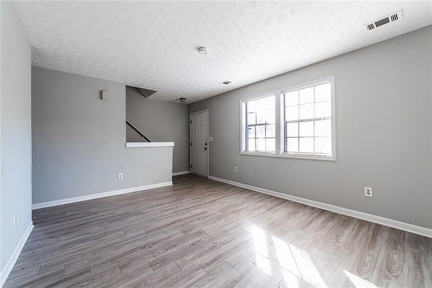 Living room gets great light. - 732 S Candler St