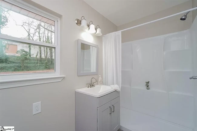 Master bathroom with new vanity, sink, toilet, and large walk-in shower. - 1 Bent Twig Dr