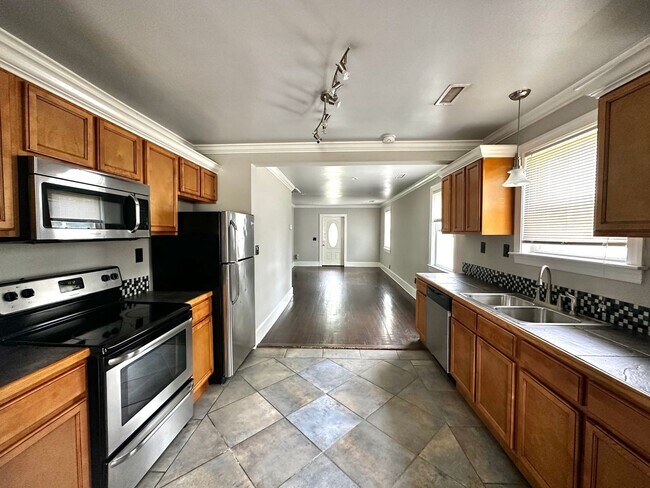 Building Photo - Updates to Inside and Outside!!  2/2 House with fence! Pet friendly!