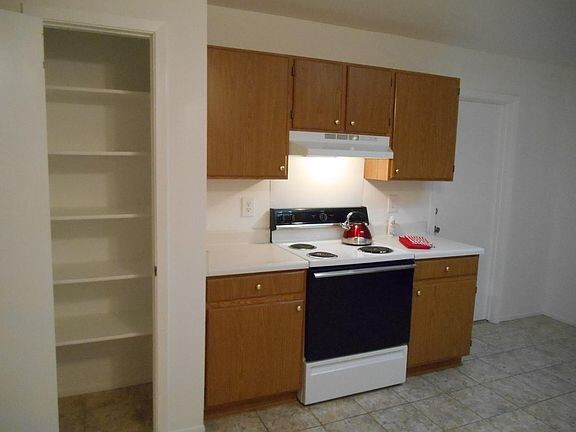 KITCHEN PANTRY AND STOVE - 6838 Cape Meadow Dr