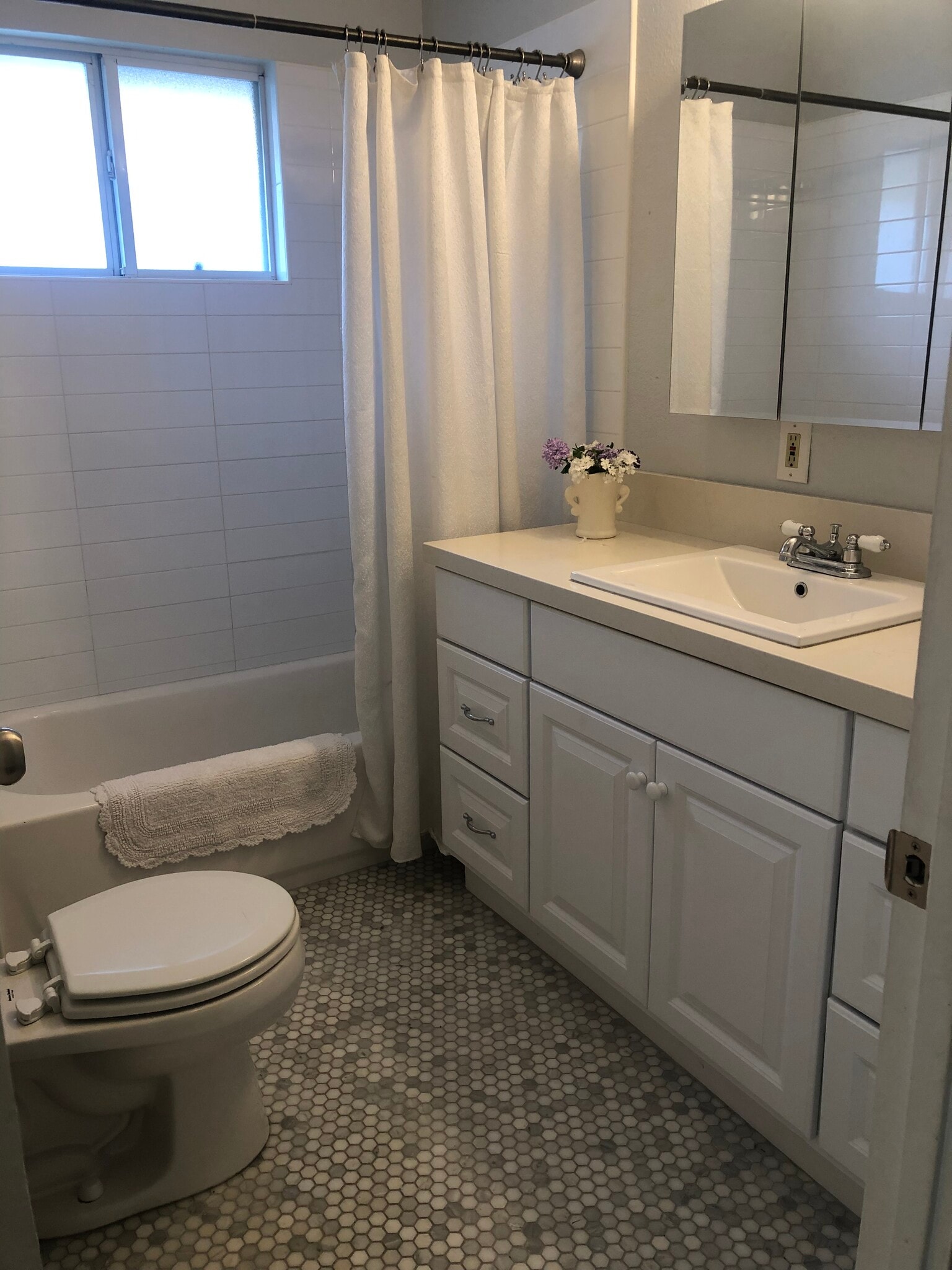 Full bath with marble counter and floor. - 2208 Gramercy Ave