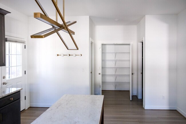 Building Photo - Like-new 3 bedroom, 2.5 bath house with an organic pond!