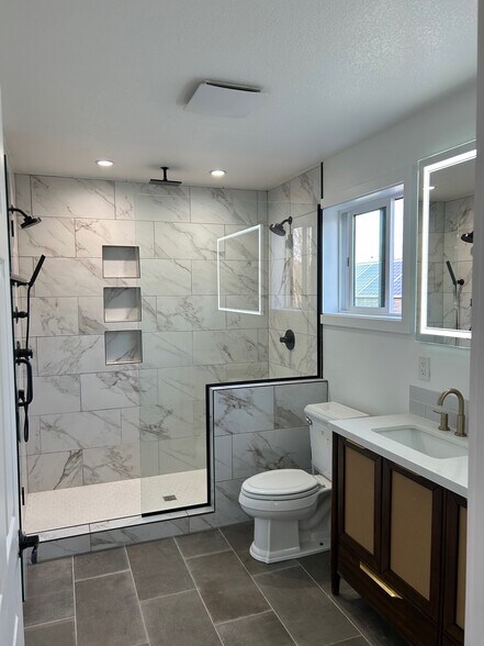 Master bedroom with walk in shower and double vainity & heated flooring - 4022 NE Mallory Ave