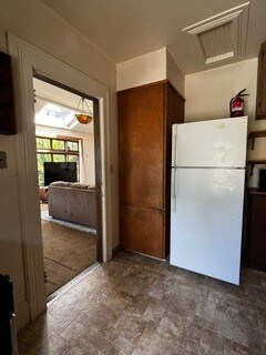 Closed storage area next to refrigerator - 2615 Parker St
