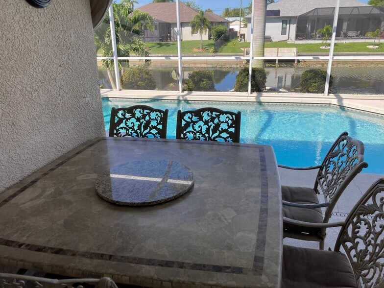 Building Photo - Short term FULLY FURNISHED vacation rental ,3/2 Pool Home on canal