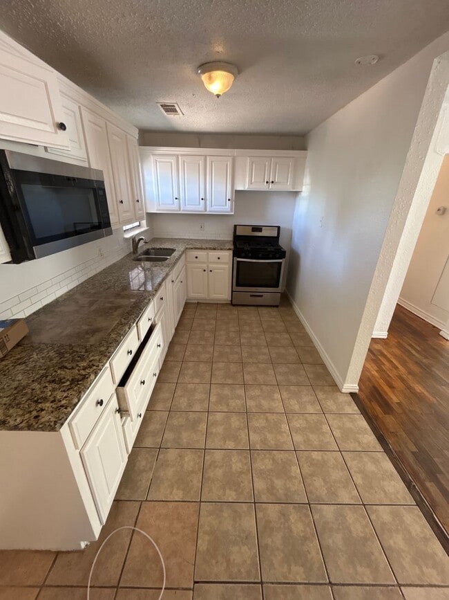 Building Photo - The stunning home feels like home!