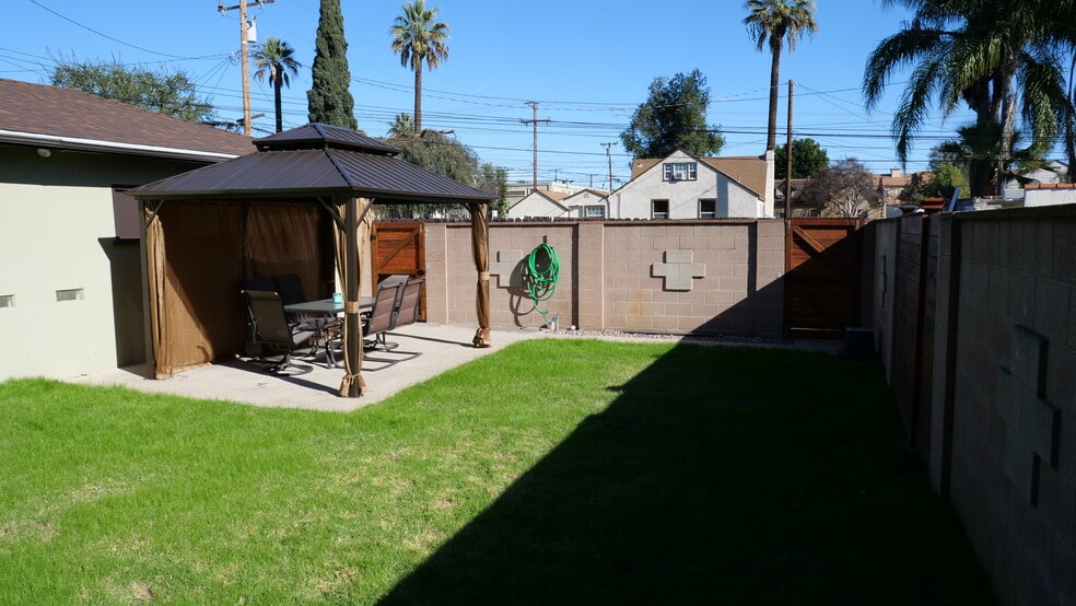 Your backyard has ample lighting for full use at night. Bring in your personal BBQ. - 259 E Puente St