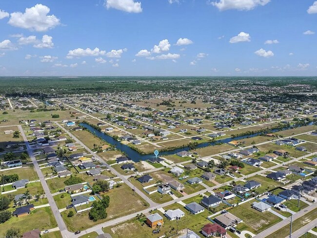 Building Photo - Almost New Construction Waterfront Home in NE Cape Featuring A Pool, Fenced Yard & More! COMING SOON
