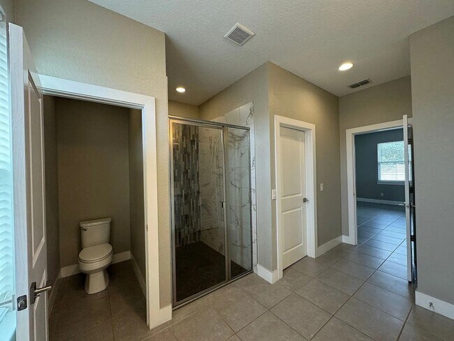 Building Photo - Beautiful New 3-Bedroom Home with Spacious Layout & 2-Car Garage in Poinciana Villages