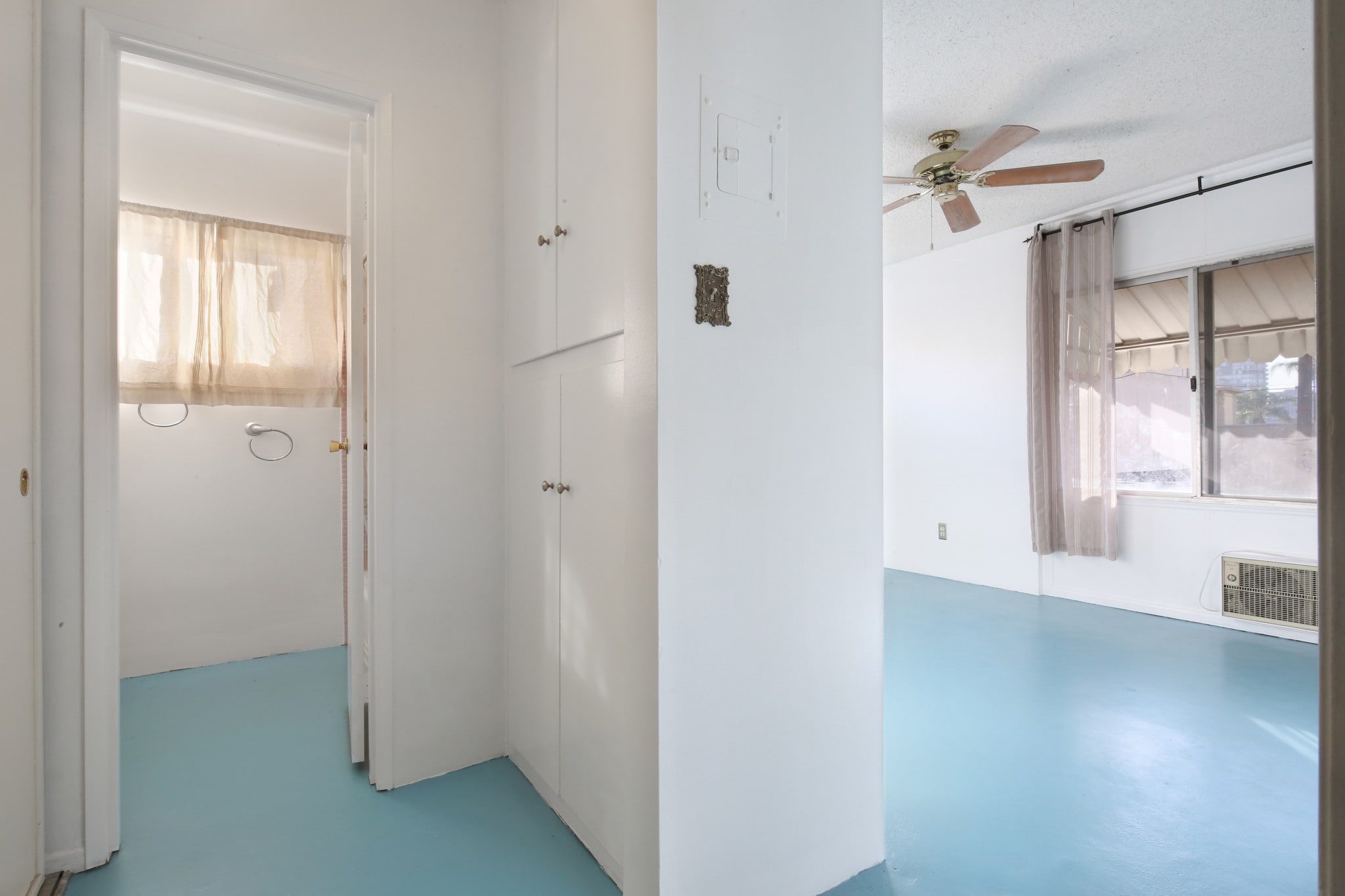 Bath on left, storage, bedroom w/ AC and fan. - 250 Linden Ave