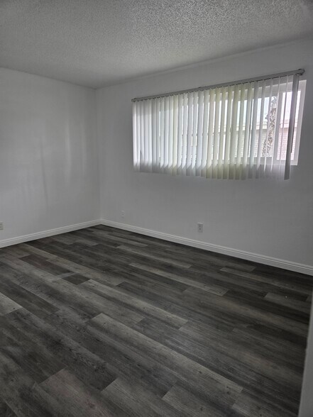 2nd bedroom with luxury vinyl plank flooring - 3455 Elm Ave