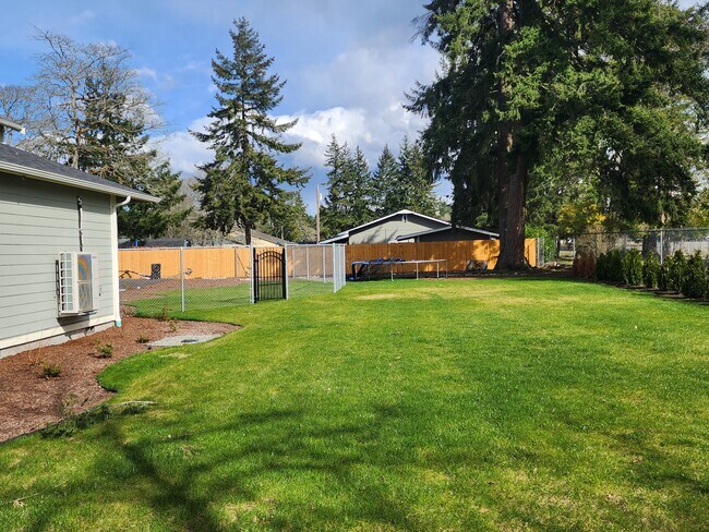 Side view (with beautiful landscape & sprinkler) - 958 152nd St E