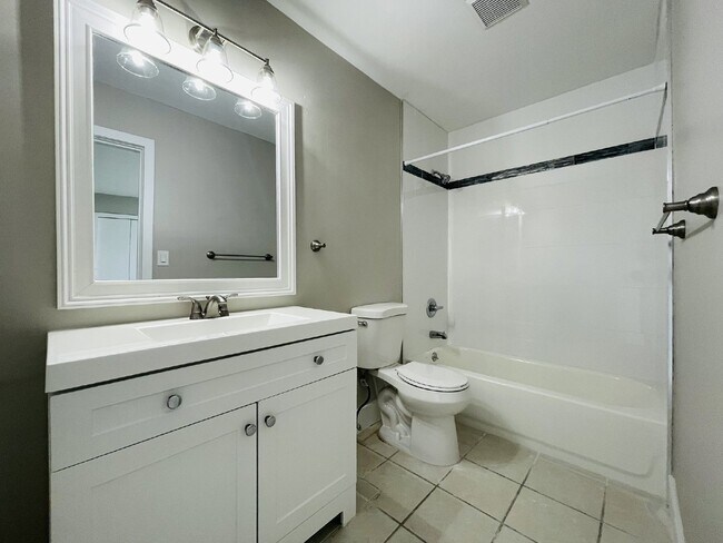 Building Photo - Updated 2-bedroom waterfront duplex with walk-in closets, enclosed Florida room, and canal views ...