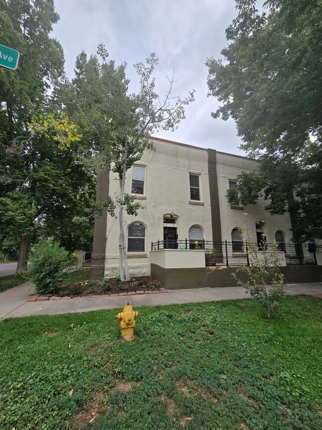 Building Photo - This updated and welcoming condo in the he...
