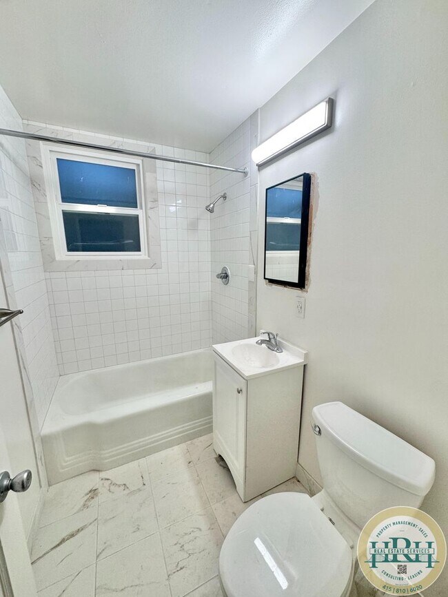 Building Photo - Spacious & Bright 2BR|1BA w/ One Garage Parking Spot Included