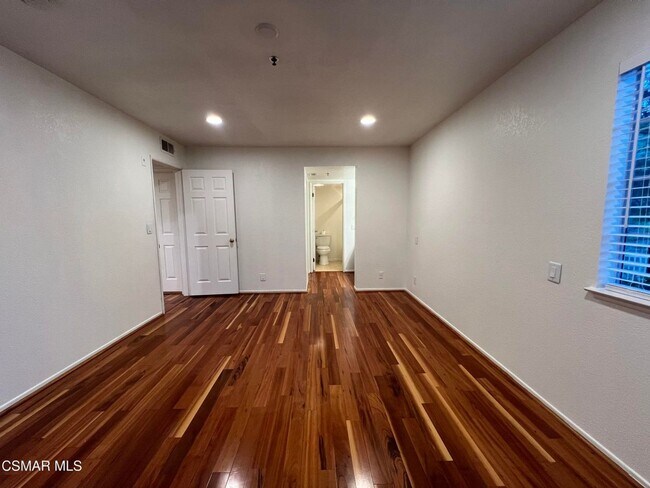 Building Photo - Welcome to this beautifully situated first-floor end unit